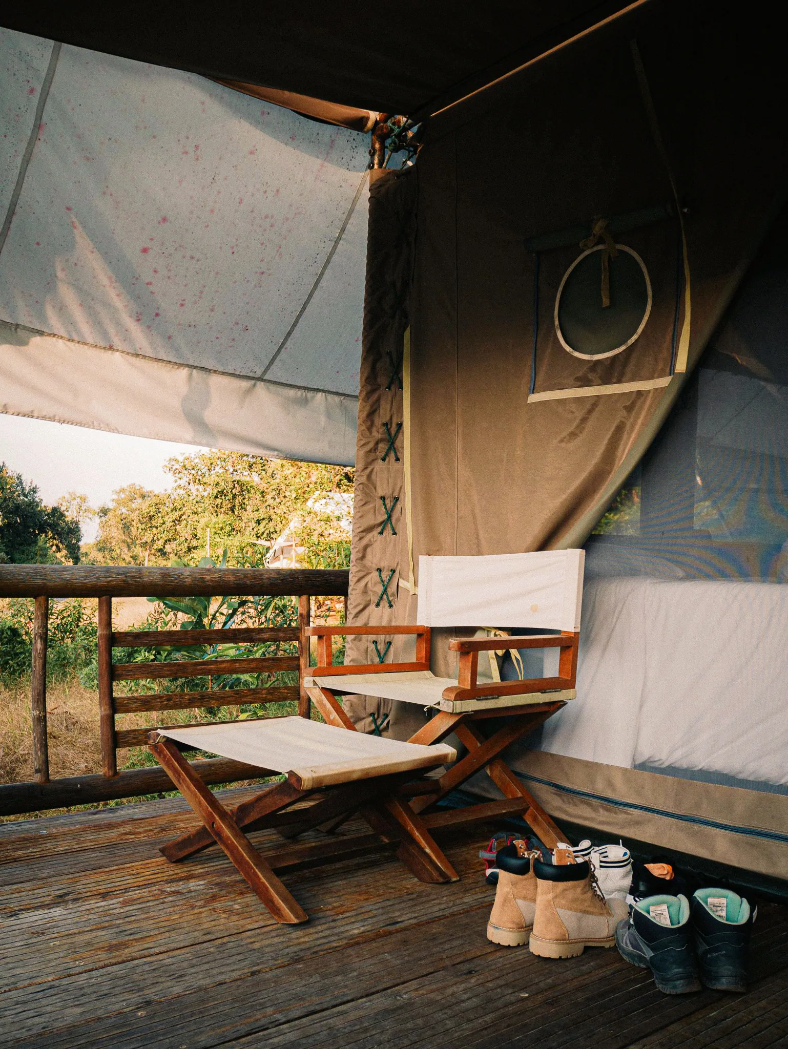 A safari tent balcony looking into the forest